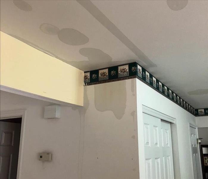 Water stains on wall and ceiling.
