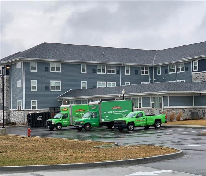 three servpro of st. charles city vehicles arriving at a facility with a sprinkler malfunction.