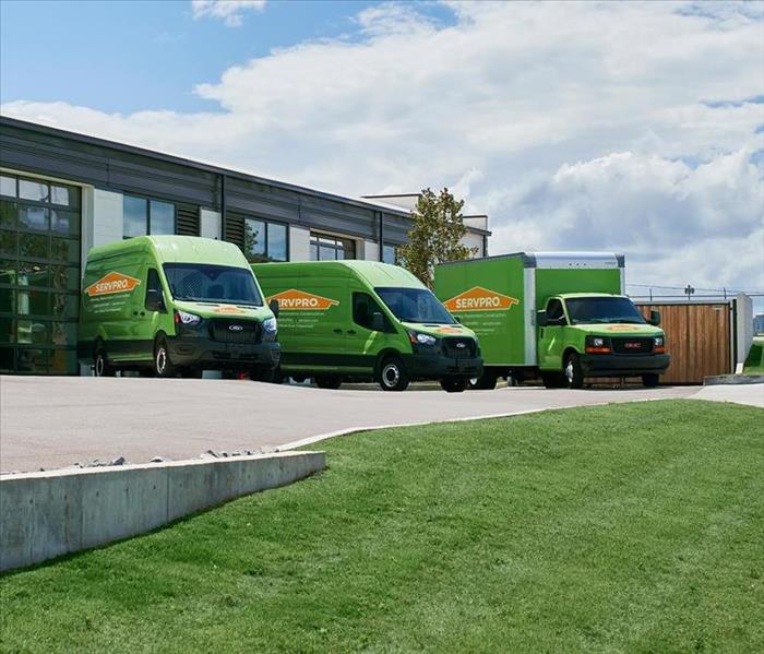 SERVPRO building with restoration vehicles parked in front